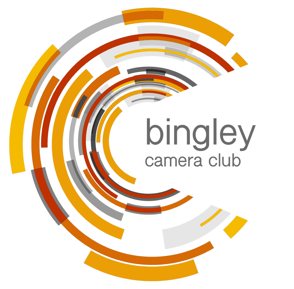 A circular abstract logo for Bingley Camera Club that is based loosely on a camera lens.